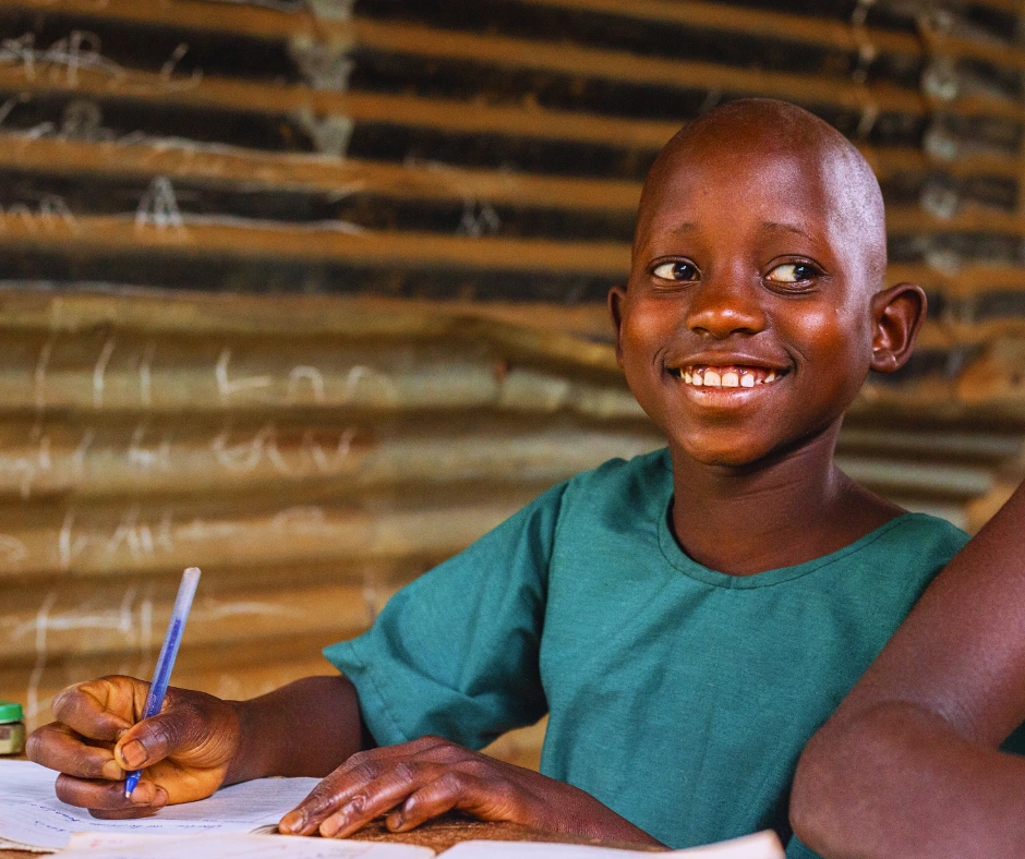 The same young girl from a rural Ugandan classroom now smiles with quiet confidence, embodying the transformation that education—and Baino Social Impact’s mission to empower children through learning—can bring to even the most challenging environments.