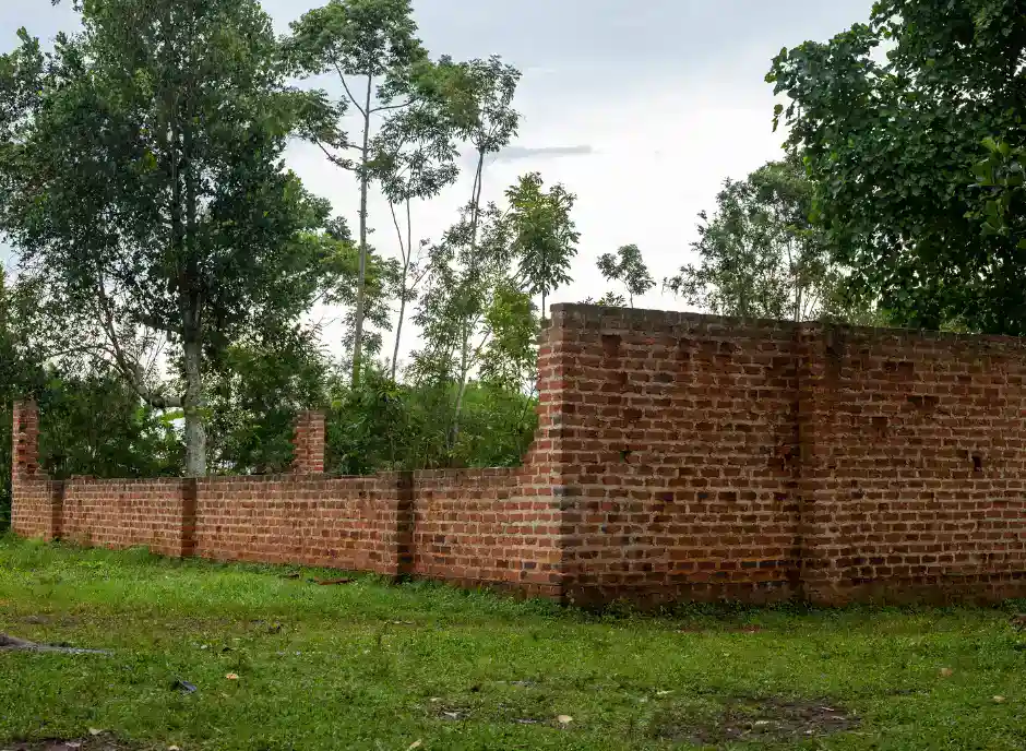 An unfinished classroom in rural Uganda stands still under the sun — a stark reminder that funding is often the first hurdle in building schools, and that Baino Social Impact’s mission depends on turning stalled progress into completed hope.