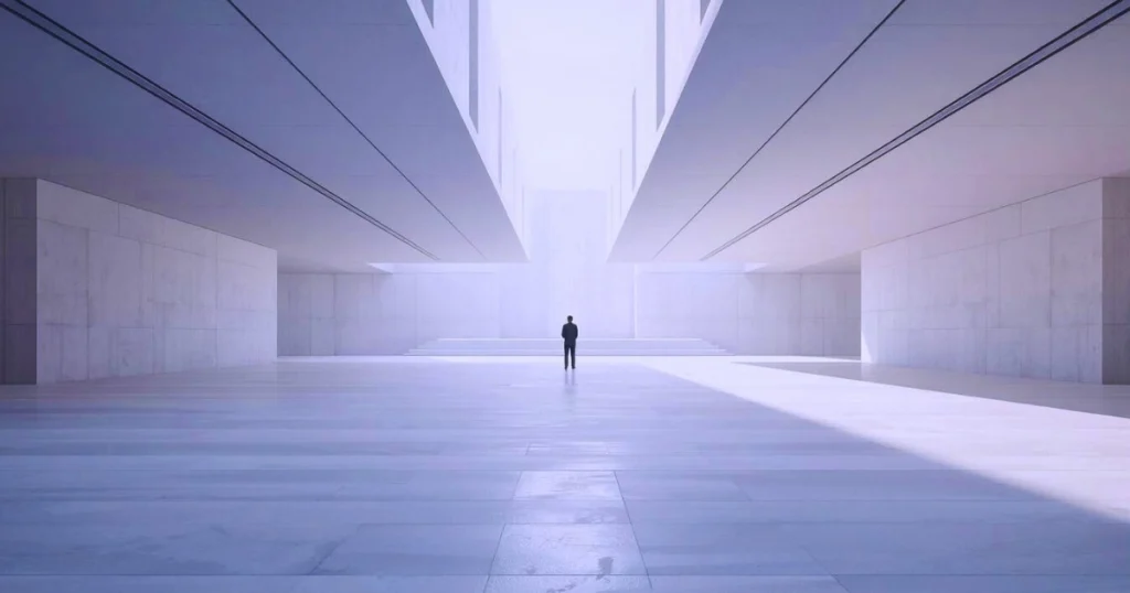 Minimalist architectural interior of repeating geometric forms leading into soft light, with a lone figure at the centre, symbolising how intention embedded in systems transforms resilience into progress.