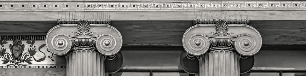 The decorations on the beam of a government justice building symbolise the strength of justice.