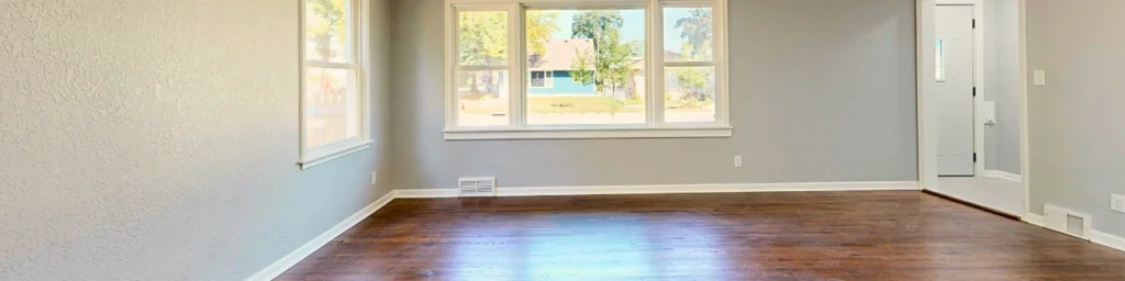 A light-filled empty room with breathable space and view suggesting freedom of thought and ease of engagement within shared systems.
