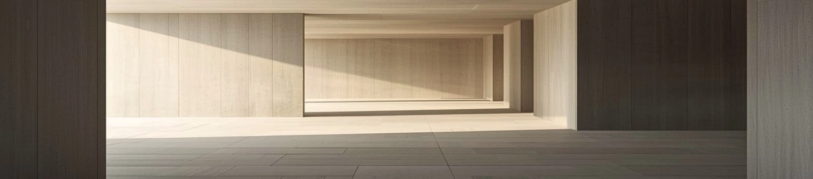 A minimalist architectural interior with linear structure and open depth, softly lit by natural light, showing a subtle interruption in the alignment of surfaces within a calm, ordered space.